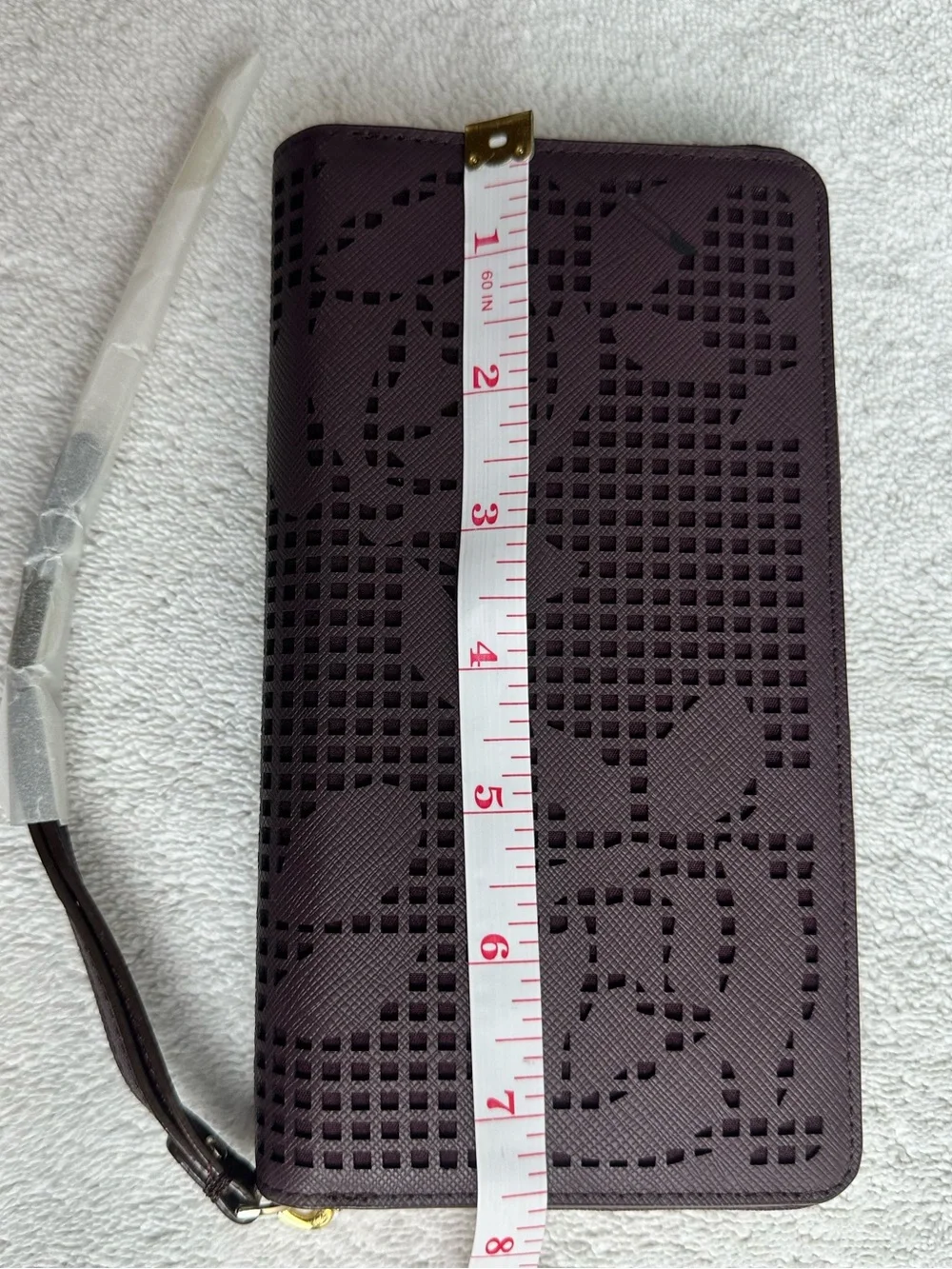 kate spade plum perforated floral zip phone wristlet